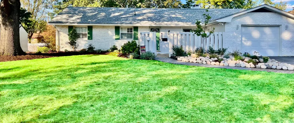 House in Upper Arlington, OH, with a healthy green lawn.