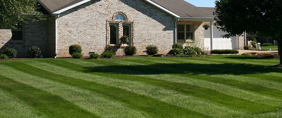 House in Upper Arlington, OH, with mowed green lawn.