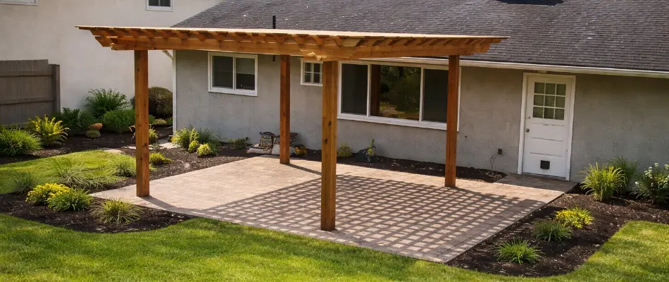 Landscape plants around a patio in Dublin, OH, with a pergola.