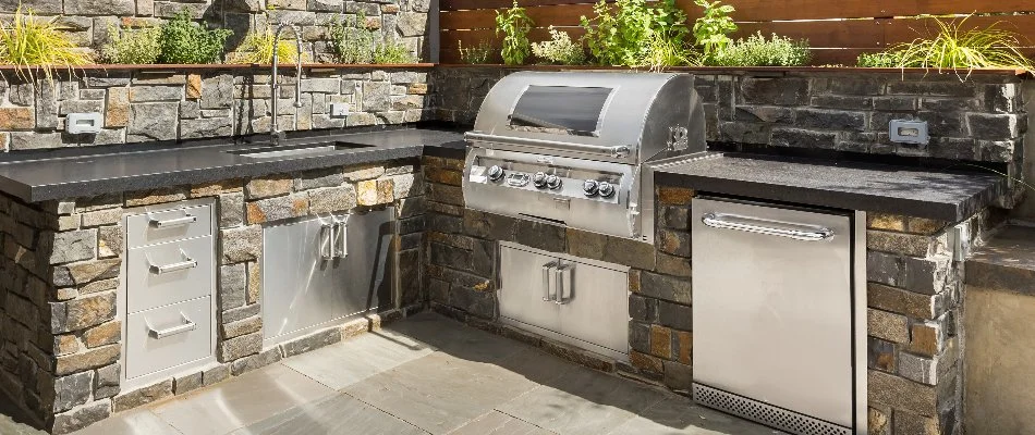Outdoor kitchen in Upper Arlington, OH, with stainless steel appliances.