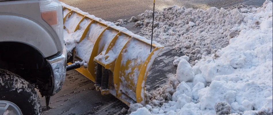 Plowing snow from icy road in Upper Arlington, OH.