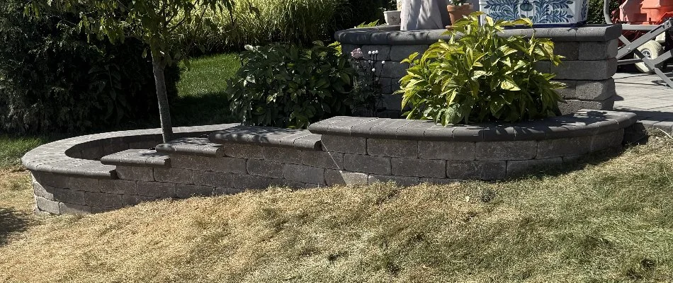 Retaining wall in Upper Arlington, OH, with plants.