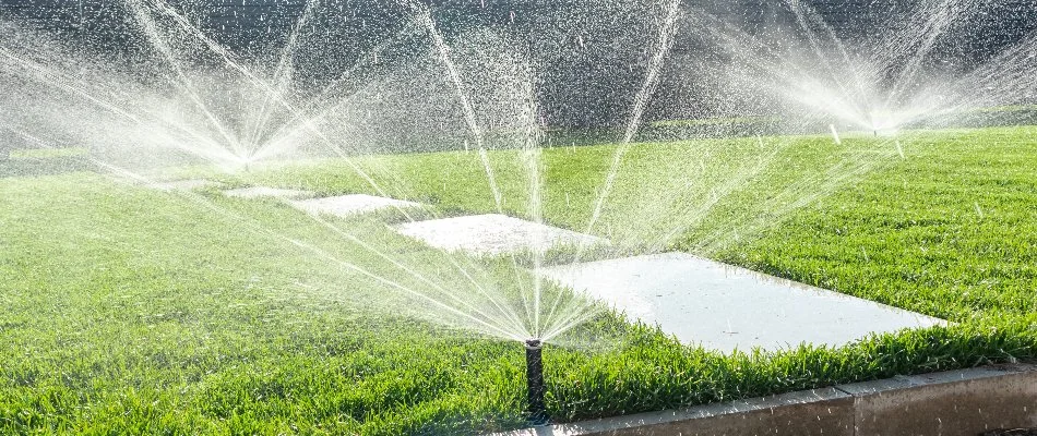 Sprinkler heads on green grass in Upper Arlington, OH.